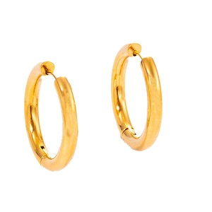 Close-up of golden stainless steel hoop earrings with polished woven wheat pattern texture