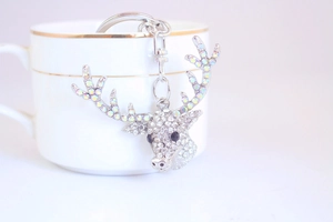 Close-up of crystal-encrusted reindeer keychain with sparkling rhinestones and lobster clasp