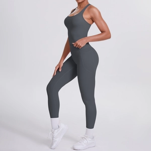 Detail view of high-waist yoga pants with side pockets in charcoal grey sportswear set