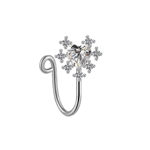 Macro detail of silver U-shaped non-piercing nose ring with heart-shaped crystal