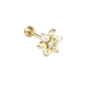 Macro detail of gold flower pearl ear stud with center zircon and screw-back closure