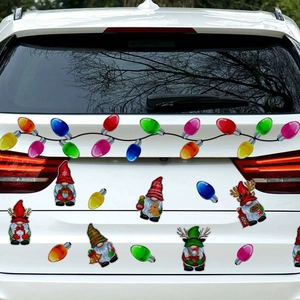 Close-up of colorful Christmas bulb and gnome reflective magnetic car stickers on a vehicle