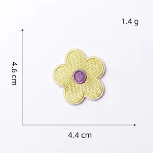 Detail view of yellow macaron flower embroidery patch showing 4.6cm size and 1.4g weight