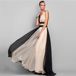 Detail of elegant two-tone V-neck sleeveless long dress with flowing color-block skirt