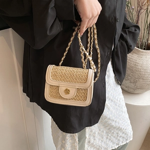 Mini woven crossbody beach bag with straw texture, contrast faux leather, and flower lock