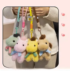 Detailed view of plush pony keychains in four pastel colors with woven lanyards