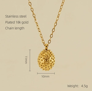 Close-up of 11mm by 10mm golden shell pendant with 18K gold plated stainless steel details
