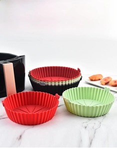Reusable air fryer silicone liners in multiple colors with oil drainage grooves