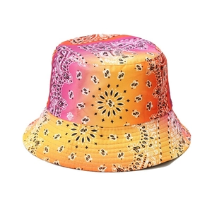 Reversible tie-dye bucket hat with pink paisley pattern for outdoor sun protection