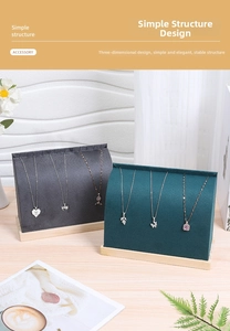 Detail view of velvet necklace display stands with solid wood base in a lifestyle setting