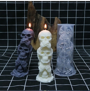 Detailed transparent silicone mold showing three stacked Halloween skulls for candle making
