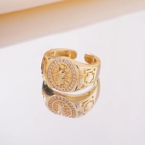 Elegant gold plated open ring featuring an oval Virgin Mary relief and rhinestone halo