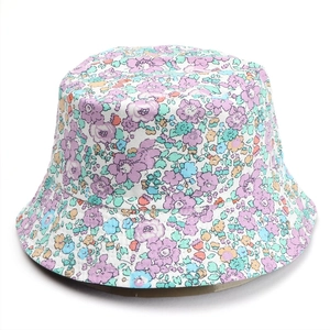 Detailed view of floral bucket hat with purple and orange prints on cotton fabric