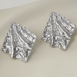 Macro view of 304 stainless steel irregular wrinkled stud earrings with molten metal texture