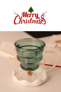 Detailed view of a double-walled glass with Christmas tree inner and snowflake patterns