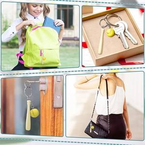 Mini baseball bat and softball keychain displayed on various bags and keys as a gift