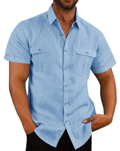 Detail of light blue linen shirt featuring dual chest pockets and textured fabric