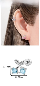 Macro shot of cherry cartilage stud earrings with zircons and precise size measurements