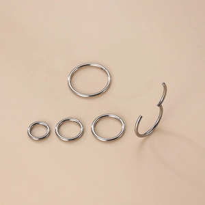 Polished silver G23 titanium seamless rings in multiple sizes for nose and ear piercing