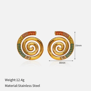 Detailed shot of 18k gold plated spiral earrings with multicolored gradient crystals