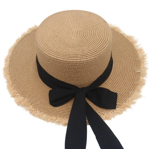 Women's French straw hat with black bow and raw fringe brim for summer sun protection