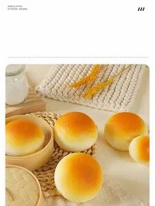 Detailed view of slow-rebound simulation buns with golden texture in a bamboo steamer
