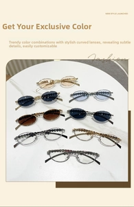 Detail of oval sunglasses featuring heart diamond embellishments and wavy metal frames