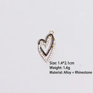 Golden double heart charm with black enamel and rhinestones, size 1.4x2.1cm