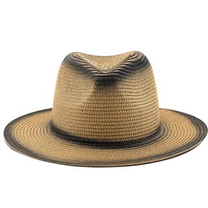 Detailed view of the woven texture and ombre brown gradient on the wide brim straw fedora