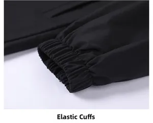 Detail of elastic cuffs on a black hooded jacket showing durable twill windproof fabric