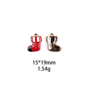 Detail of Santa sock alloy charms in red enamel and gold finish with size 15x19mm