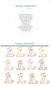 Detail of dog-shaped carbon steel paper clips with eco-friendly plating in rose gold