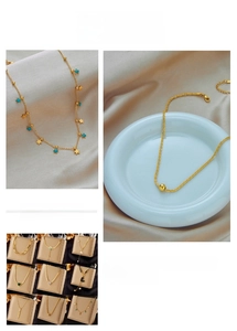 Macro shot of gold pendant necklaces featuring star, heart, and gemstone charms