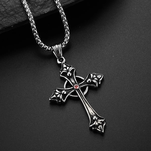 Gothic silver cross necklace with red gemstone and fleur-de-lis accents on black stone