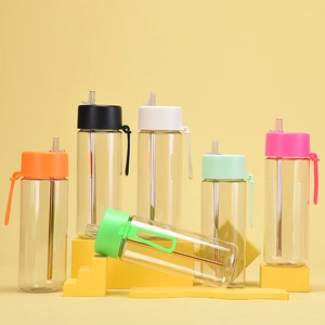 Close-up of 740ml Tritan water bottles with straws and colorful silicone handles