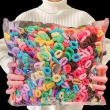 Wholesale bulk pack of colorful fabric hair scrunchies in transparent plastic bag