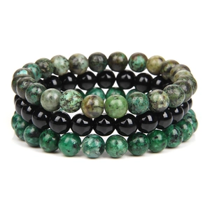 Detail showing natural green stone and black obsidian beaded stretch bracelets set
