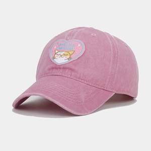 Detail of pink washed cotton baseball cap with embroidered heart and cat patch
