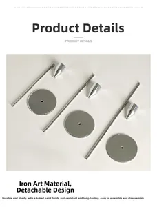 Detail view of disassembled silver iron candle holder parts with polished paint finish