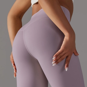 Detailed shot of lavender high-waisted yoga leggings showing the butt-lifting seam design