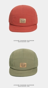 Detailed view of 5-panel quick-dry camping caps in brick red and olive green with leather patch