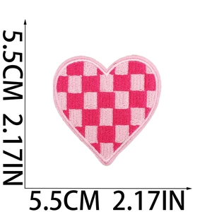 Detailed view of pink checkered heart embroidery patch with 5.5cm size dimensions