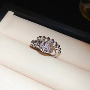 Elegant silver snake ring with pavé zircons on premium jewelry box display