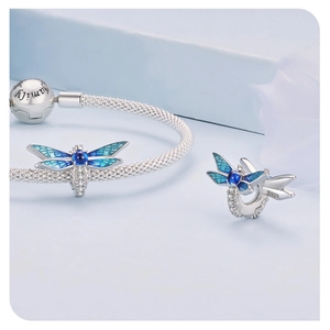 Detailed macro view of S925 sterling silver dragonfly charm with blue enamel on snake chain