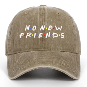 Close-up of No New Friends embroidery on vintage washed cotton baseball cap with dots