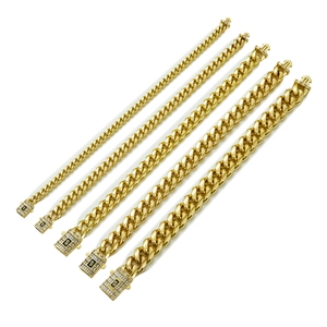 Detail of 14K gold plated Cuban link chains in various widths with zircon paved clasps