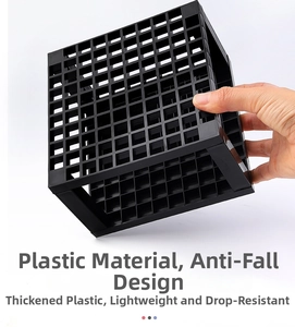 Detail of durable thickened black plastic 96-hole brush holder with reinforced grid frame