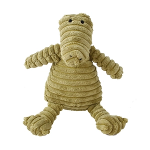 Detailed close-up of corduroy texture on green crocodile plush squeaky dog toy