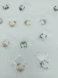 Detail of magnetic stainless steel septum rings in multiple colors with individual packaging