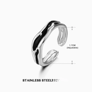 Detail of adjustable silver stainless steel ring with black enamel drip design